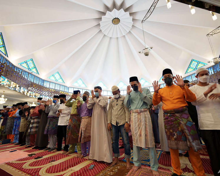 Muslims mark Eid al-Fitr holiday with joy, worry