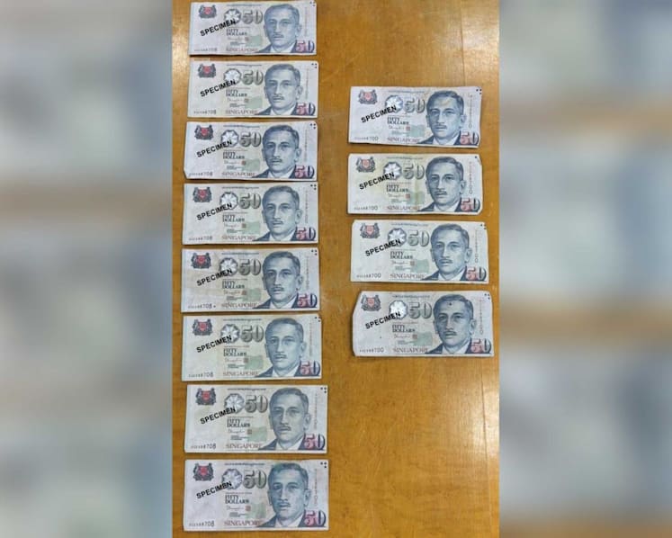 Two men to be charged with use, possession of counterfeit S$50 notes