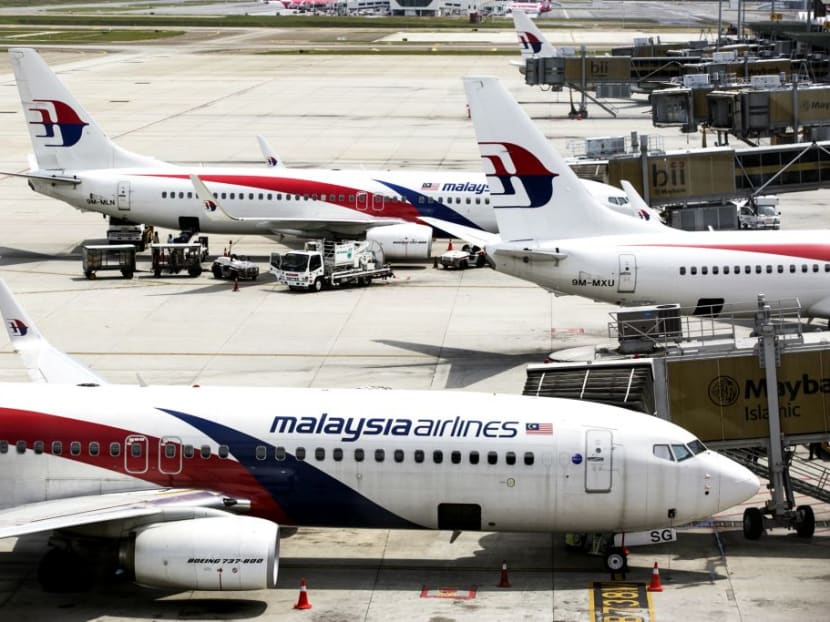Aircraft operated by Malaysian Airlines stand on the tarmac at Kuala Lumpur International Airport (KLIA) in Sepang, Malaysia. Bloomberg file photo Aircraft operated by Malaysian Airlines stand on the tarmac at Kuala Lumpur International Airport (KLIA) in Sepang, Malaysia. Bloomberg file photo