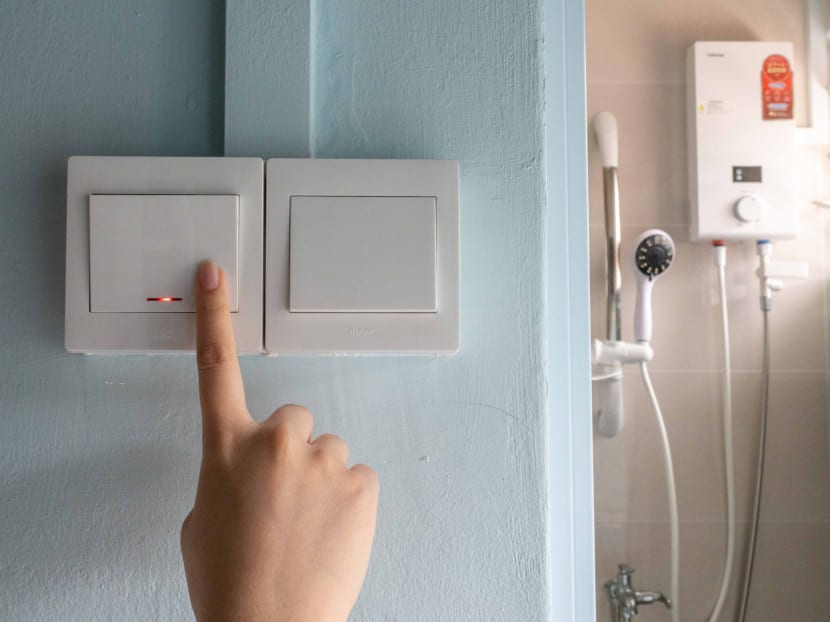 A double pole switch outside a bathroom being pressed for a water heater that is typically installed in public flats. Such switches should be used, electricians said, instead of a power socket for a standard three-pin plug often seen in other home appliances. A double pole switch outside a bathroom being pressed for a water heater that is typically installed in public flats. Such switches should be used, electricians said, instead of a power socket for a standard three-pin plug often seen in other home appliances.