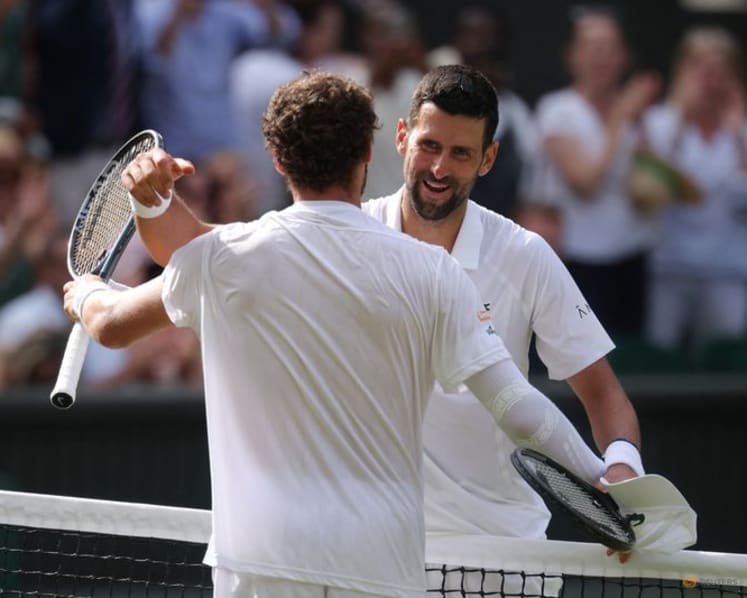 Djokovic moves past another Federer milestone to make Wimbledon quarter-finals