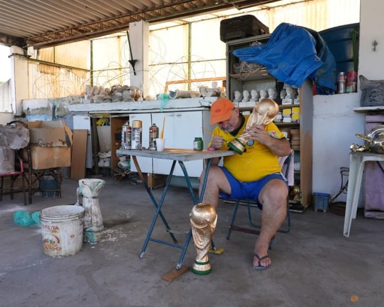 In Rio, artisan crafts World Cup trophies while hoping Brazil gets a real one