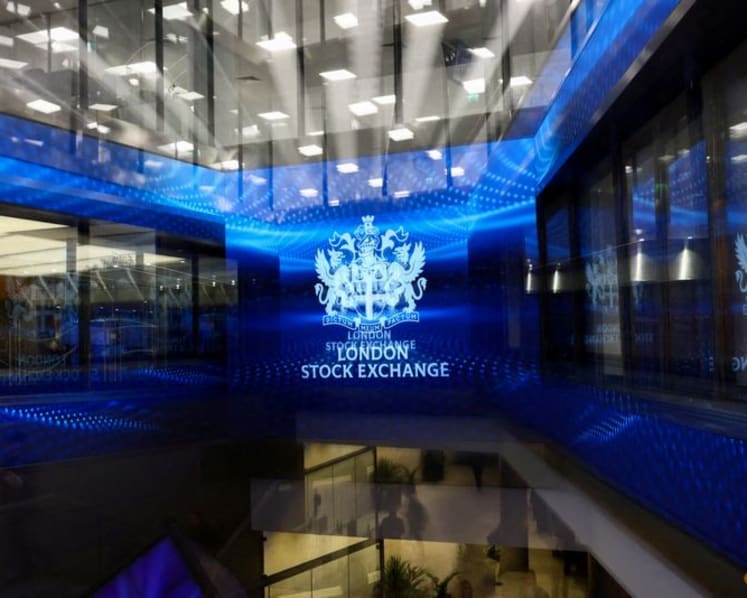 Stocks surge on chip news, oil holds at pre-war levels