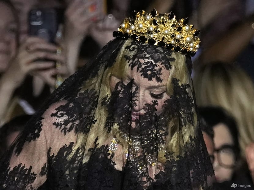 Madonna makes veiled entrance at Dolce & Gabbana show to celebrate her 1990s heyday Madonna makes veiled entrance at Dolce & Gabbana show to celebrate her 1990s heyday