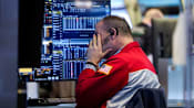 Dow confirms correction as traders worry about war