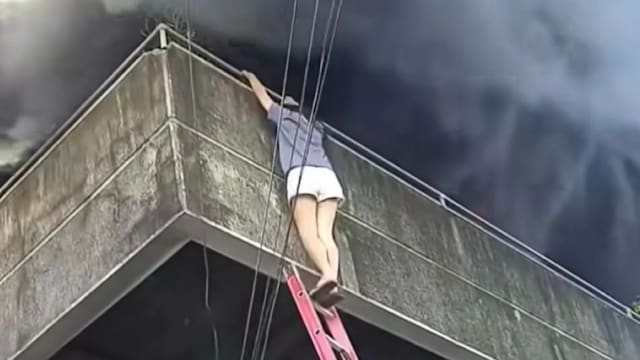 菲律宾女子火场先救两犬再逃生 英勇举动获网民力赞