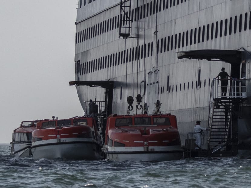 Passengers of Holland America's cruise ship Zaandam are transferred to the Rotterdam cruise ship in Panama City bay on March 28, 2020. Passengers of Holland America's cruise ship Zaandam are transferred to the Rotterdam cruise ship in Panama City bay on March 28, 2020.