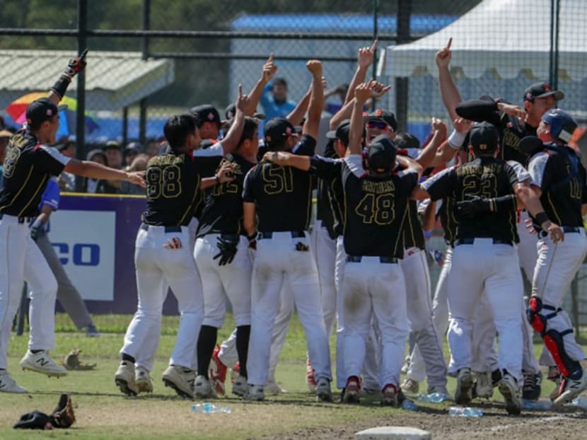 Singapore men's softball team celebrate their historic gold at the 2019 SEA Games on Sunday Dec 8, 2019.