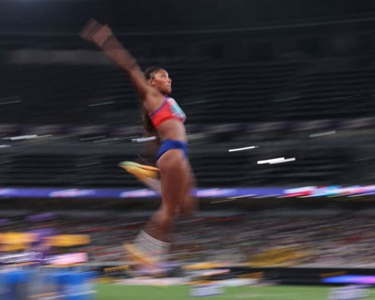 Davis-Woodhall adds world long jump title to Olympic crown