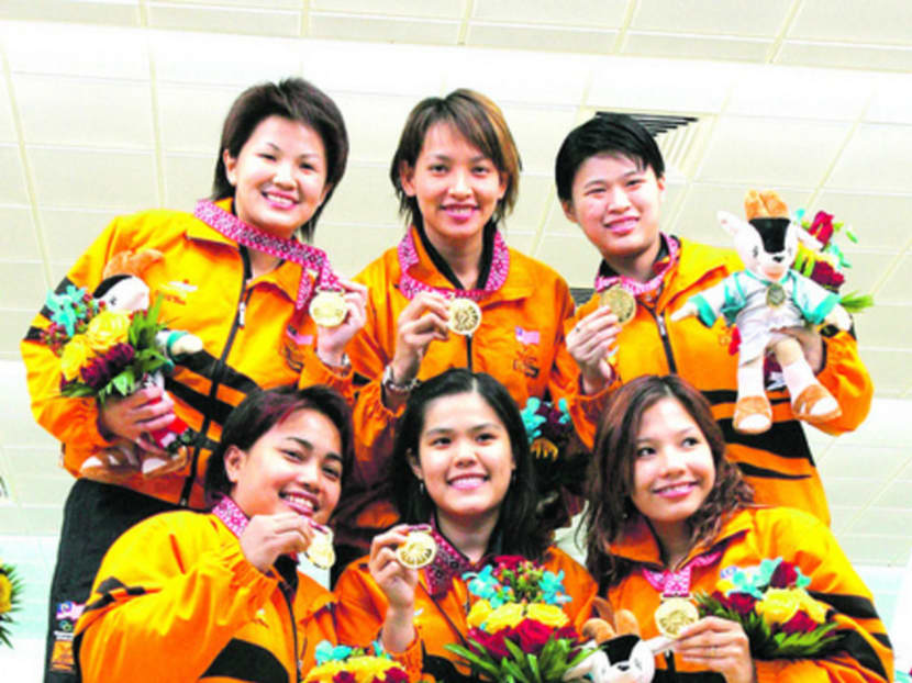 Malaysian bowling players Cheah Mei Lan Easther, Koh Suet Len Sharon, Chai De Choo Wendy, Zandra Aziela, Shalin Zulkifli and Choy Poh Lai pose with their gold medals after winning the Women's Five Player Teams during the 15th Asian Games Doha 2006 at Qatar Bowling Centre on December 8, 2006 in Doha, Qatar. Photo: Getty Images