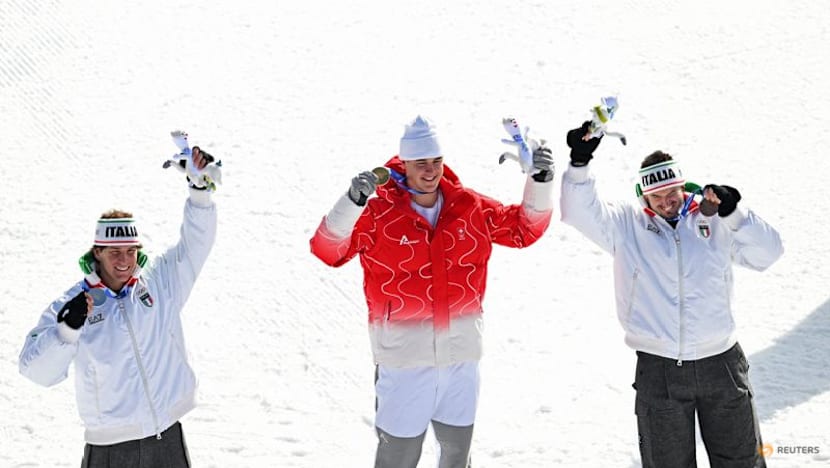 Alpine skiing-Swiss upstart Von Allmen stuns Odermatt to win downhill gold