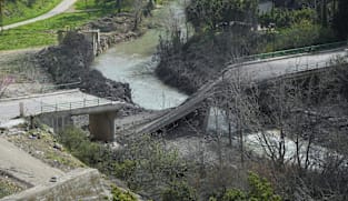 Israel destroys bridge in Lebanon, threatens Gaza-scale destruction