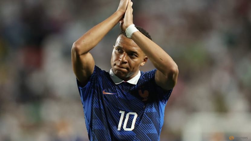 Mbappe double sends France into knockout rounds after lengthy weather delay