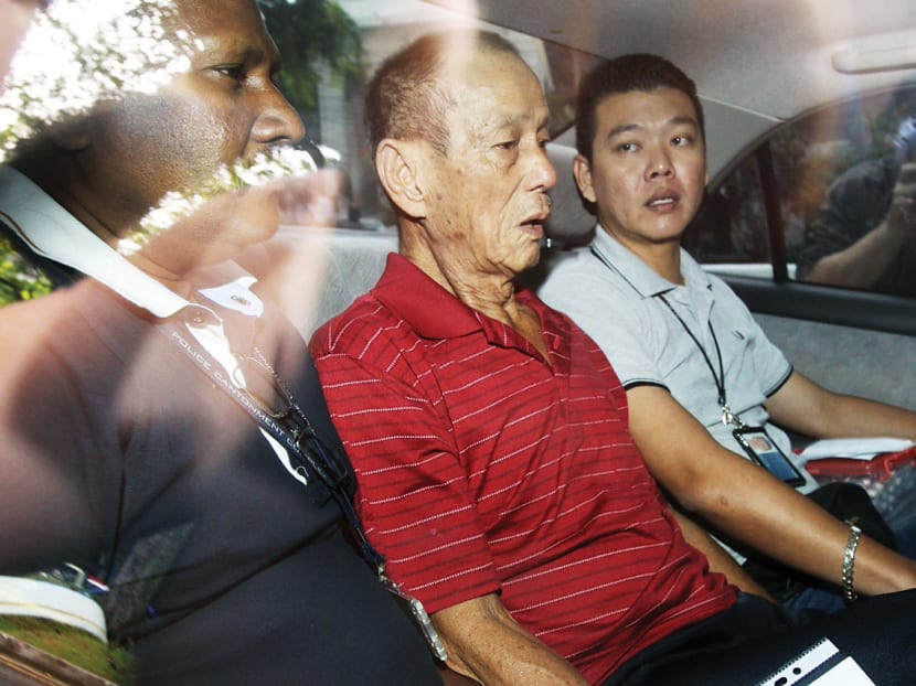 Char Chin Fah (in red) arriving at the State Courts yesterday. Photo: Don Wong