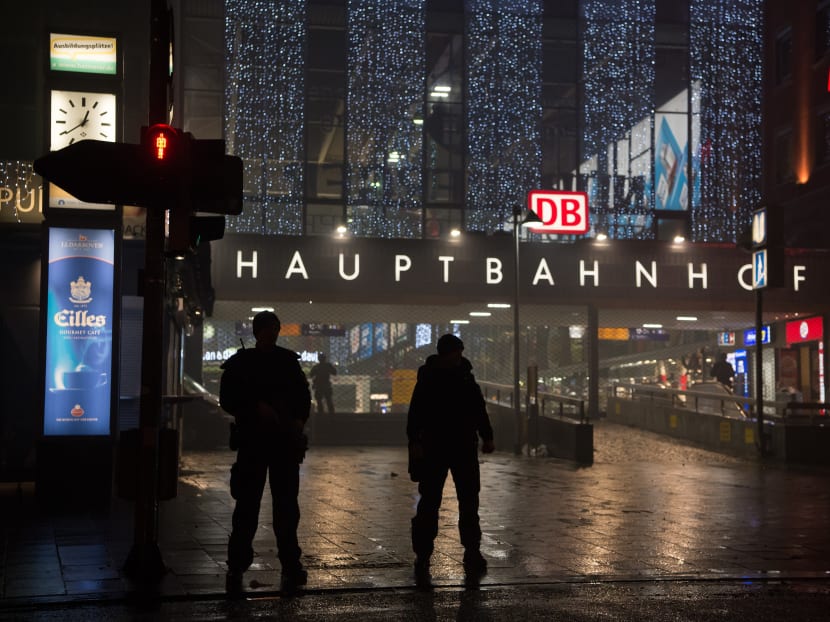 German special police stand in front of the Munich, southern Germany, main train station yesterday evening, Dec 31, 2015 after police warned of 'imminent threat' of terror attack and ordered two train stations to be cleared. Photo: dpa via AP