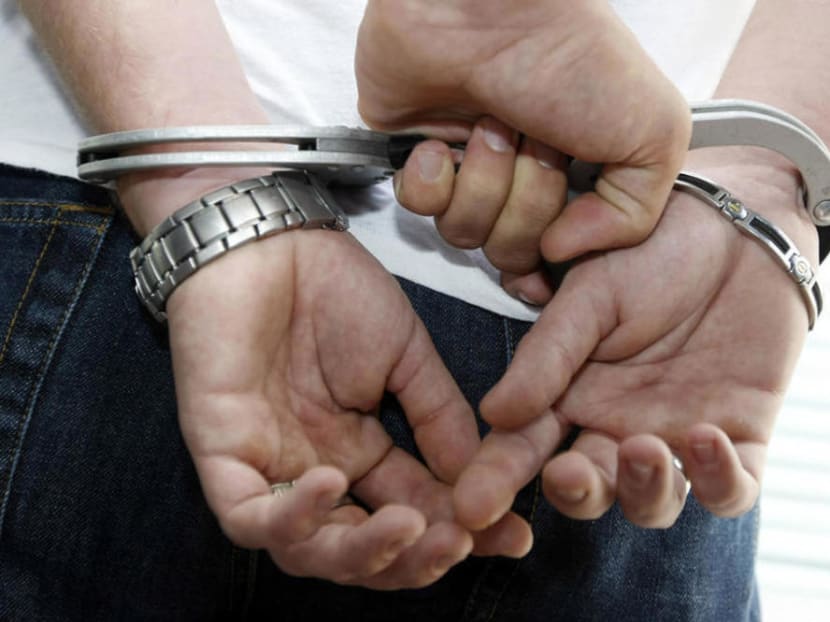 While cooking a meal, Saw Paing Soe Thu became uneasy after his co-worker Aung Win Htut approached him from behind without clothes on.