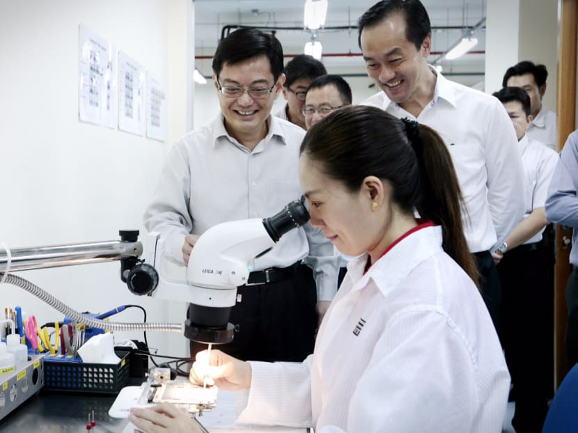 Min Heng Swee Keat and MOS Koh Poh Koon attend a tour of the Feinmetall facility on March 28, 2016. Photo: Jason Quah/ TODAY Min Heng Swee Keat and MOS Koh Poh Koon attend a tour of the Feinmetall facility on March 28, 2016. Photo: Jason Quah/ TODAY