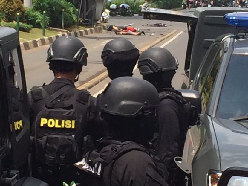 Seven dead in Jakarta blasts, gunfight