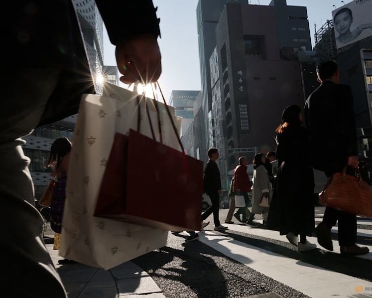 Japan keeps view economy recovering but warns risk from Middle East