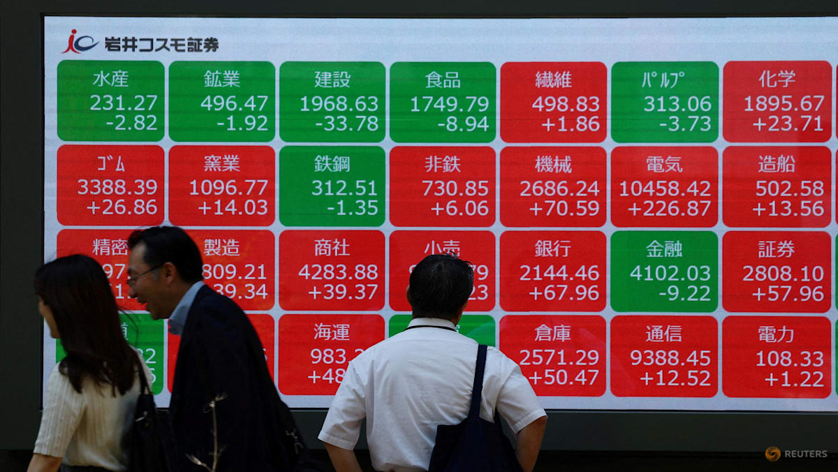 Asian markets tumble as tech bubble fears grow