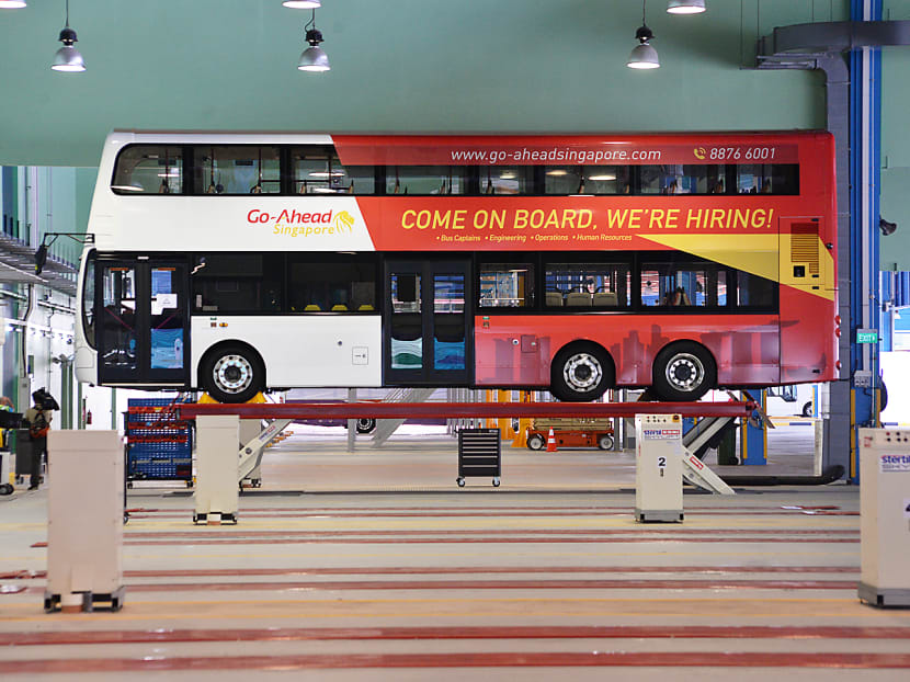 A Go-Ahead Singapore bus propped up with a Skylift for maintainence works at Loyang Bus Depot. Photo: Robin Choo