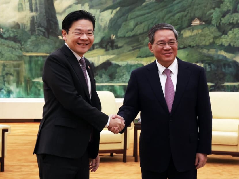 Singapore's Deputy Prime Minister Lawrence Wong (left) with China's Premier Li Qiang at a bilateral meeting in Beijing on Dec 6, 2023. 