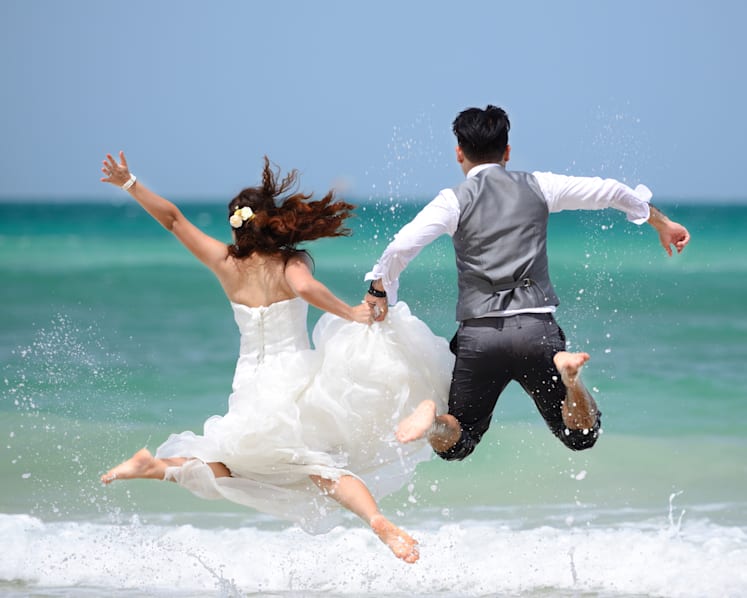 Commentary: Why are people spending more on travel and weddings even as prices go up?