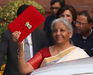 In focus at India’s upcoming Budget 2026 – a sweet dish, a red cloth ledger, and implementation