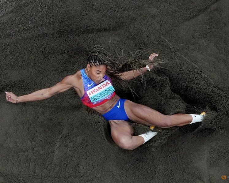 Davis-Woodhall adds world long jump title to Olympic crown