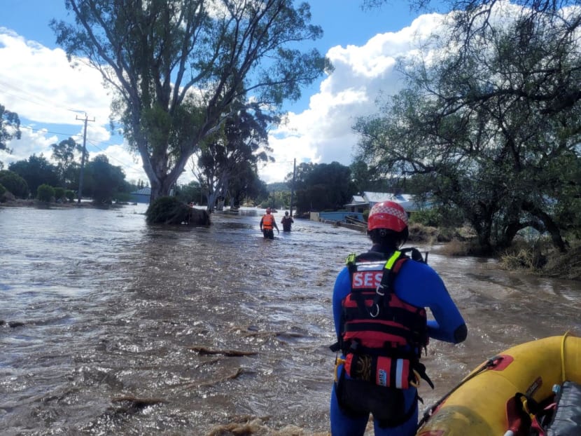 Handout photograph taken on Nov 14, 2022 and released by New South Wales State Emergency Service shows officials in rescue work in the flooded towns around the overflowing Wyangala Dam near Cowra.