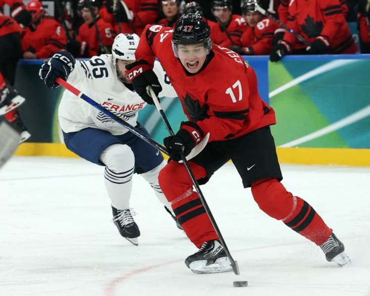 Ice hockey-Canada thrash France 10-2, Swiss top Czechs in OT, Denmark down Latvia