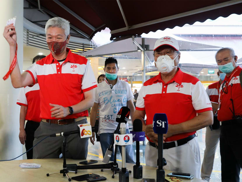 Dr Tan Cheng Bock (front row, right) presented a party membership card to Mr Lee Hsien Yang (front row, left) during a Progress Singapore Party breakfast meeting at Tiong Bahru Market on June 24, 2020. Dr Tan Cheng Bock (front row, right) presented a party membership card to Mr Lee Hsien Yang (front row, left) during a Progress Singapore Party breakfast meeting at Tiong Bahru Market on June 24, 2020.