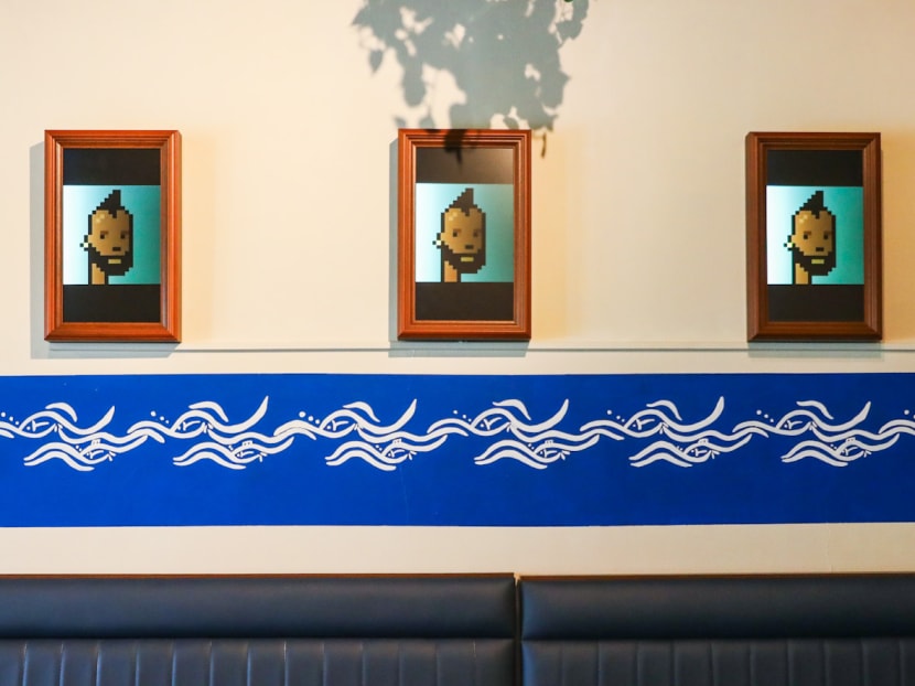 NFT artwork CryptoPunk #7923, created by Larva Labs, is displayed in a restaurant at Owen Road. 