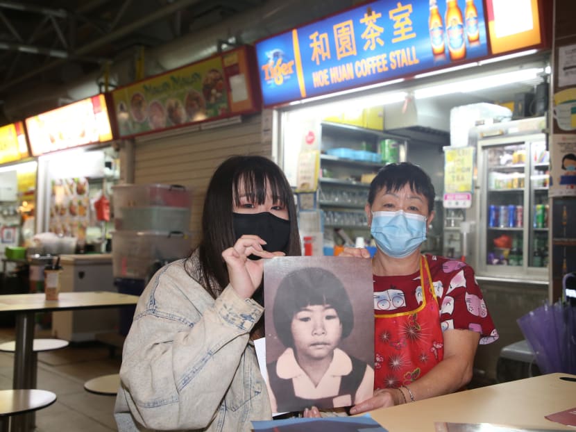 Madam Ang Goon Lay and her daughter Lim Jia Hui with a photo of Shiow Rong, in front of their drink stall at Lorong 5 Toa Payoh on Jan 10, 2021.