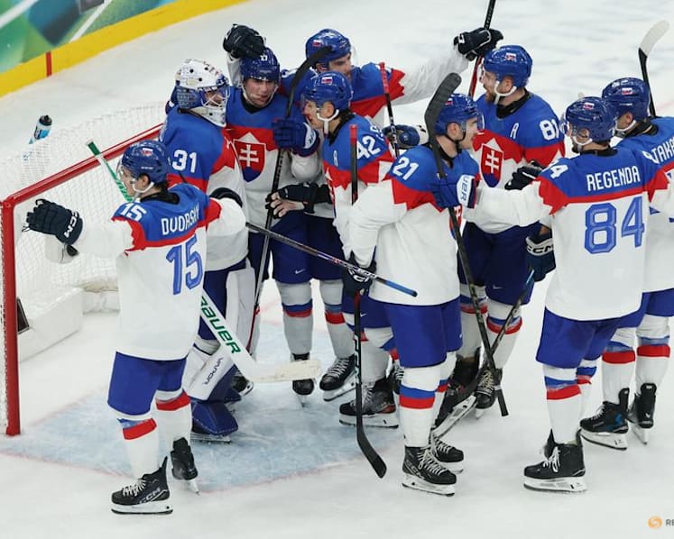 Ice hockey-Slovakia win group, US beat Denmark, Finland, Latvia notch wins