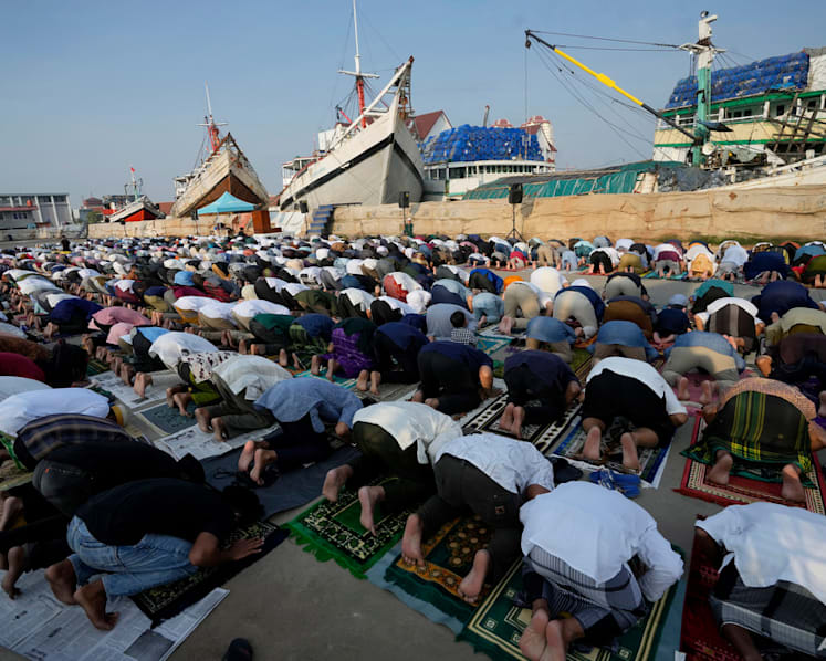 Muslims mark Eid al-Fitr holiday with joy, worry