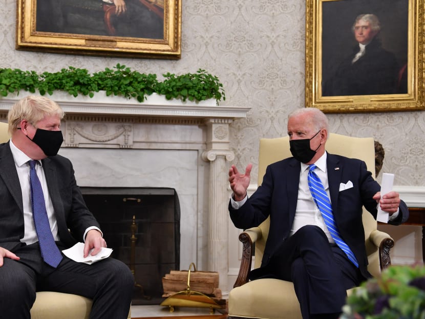 US President Joe Biden (right) holds a bilateral meeting with Britain's Prime Minister Boris Johnson at the Oval Office of the White House in Washington, DC on September 21, 2021