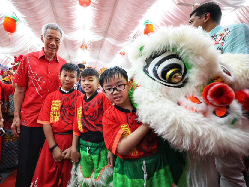 Prime Minister Lee Hsien Loong (far left) posing with young lion-dancers in 2023 during the Chinese New Year period. Prime Minister Lee Hsien Loong (far left) posing with young lion-dancers in 2023 during the Chinese New Year period.