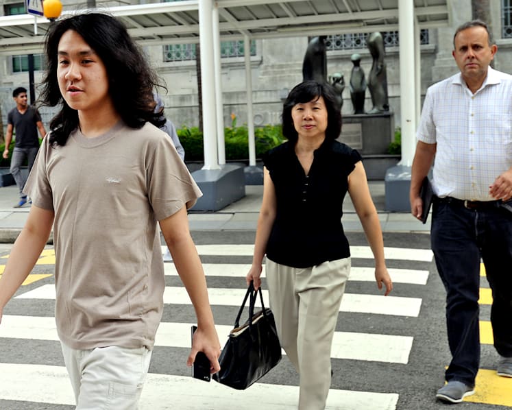 Amos Yee claims trial to 8 charges, bail extended