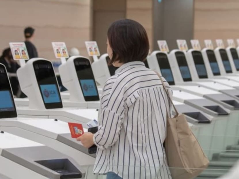 File photo of a passenger clearing immigration at an automated lane at Changi Airport Terminal 2. File photo of a passenger clearing immigration at an automated lane at Changi Airport Terminal 2.