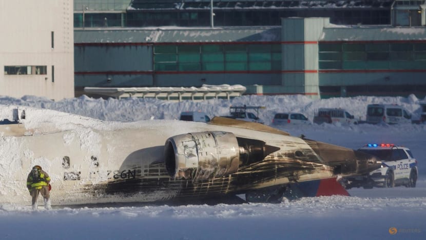 Delta plane flips on landing at Toronto airport, injuring 18 Delta plane flips on landing at Toronto airport, injuring 18