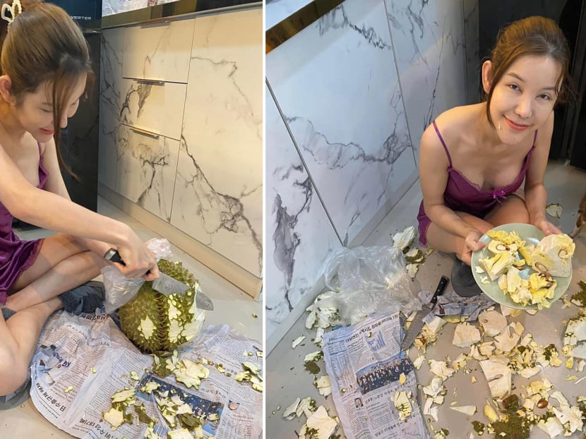 Woman horrifies netizens by chopping a durian like a coconut and eating the slivers