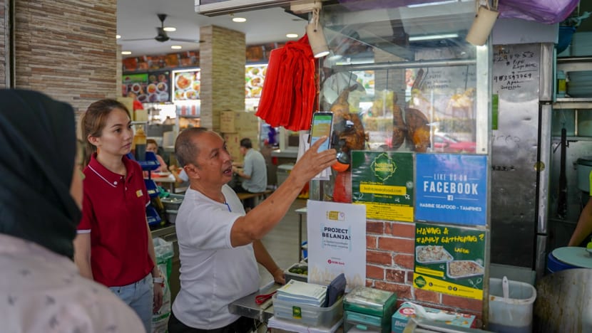 Order, scan, eat: Seniors-in-need go high-tech to claim daily hot meals from food stalls