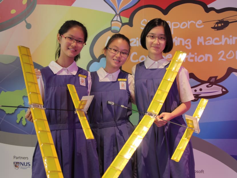 CHIJ St Nicholas Girls’ School’s Trio Dynamic team, made up of (L–R) Tang Yurou, Carissa Seet and Victoria Leong, with their unpowered gliders. Photo: Zara Zhuang