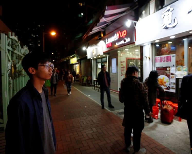 Hong Kong exiled activist says he was paid by authorities to be informant: Reuters