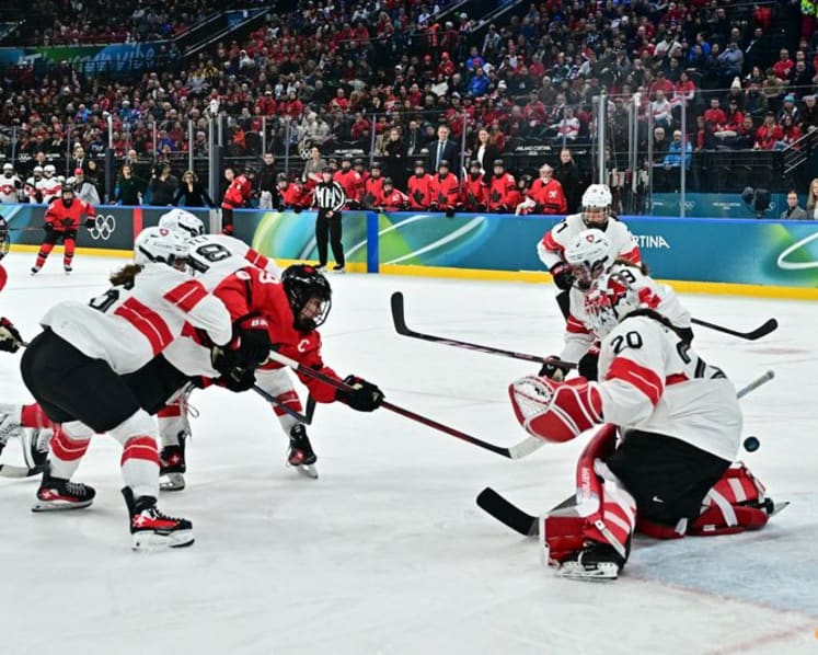 Ice hockey-Canada look to captain Poulin in title defence after goal-scoring record