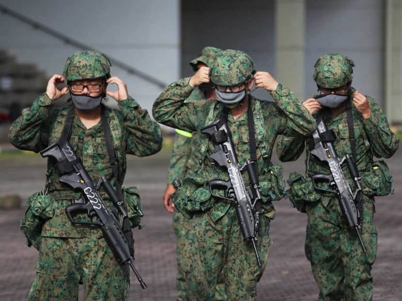 Recruits putting on their masks during a training session at BMT Centre on Pulau Tekong, Oct 1, 2020. Recruits putting on their masks during a training session at BMT Centre on Pulau Tekong, Oct 1, 2020.