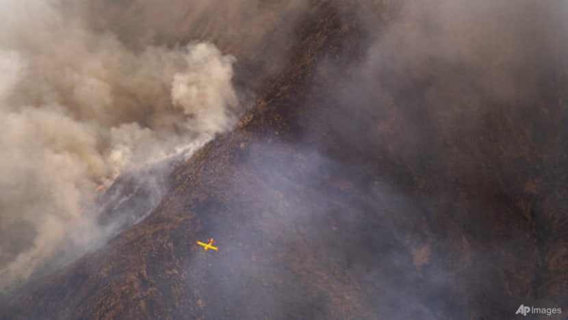 Rainfall helps firefighters control southern Spain's inferno