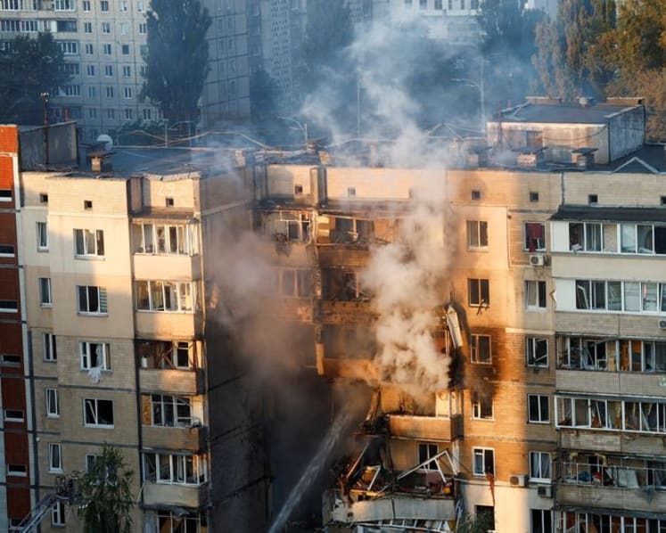 Russia hits Ukraine with biggest air attack of war, sets government building ablaze