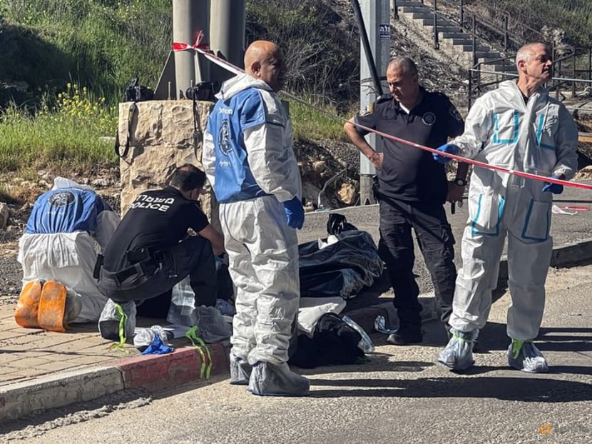 Israeli forces work at the scene of a suspected attack at a checkpoint outside of Jerusalem, in the Israeli-occupied West Bank, on March 13, 2024. 